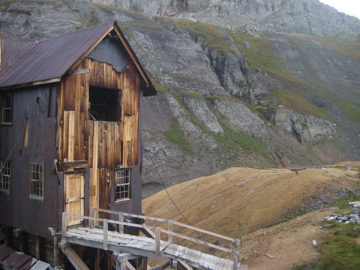 IMG_0239-1920w a wooden house with a mountain in the background